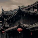 Traditional Chinese architecture with red lanterns, symbolizing the rich cultural heritage behind acupuncture and ancient healing practices.